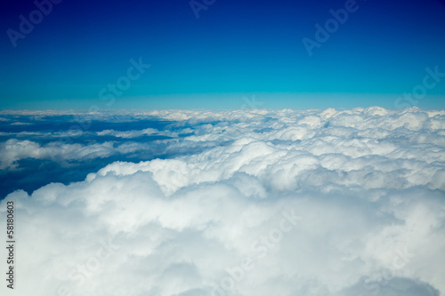 Aerial fluffy clouds view from high like a sea