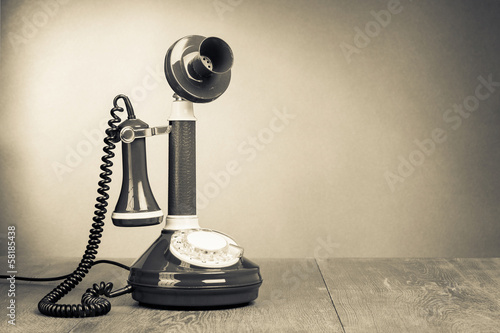 Canvastavla Retro rotary telephone on table for vintage background