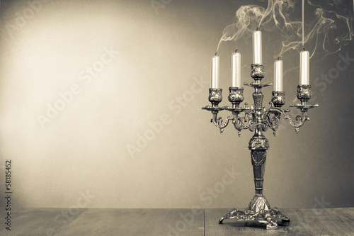 Vintage candelabrum with five reek candles sepia photo
