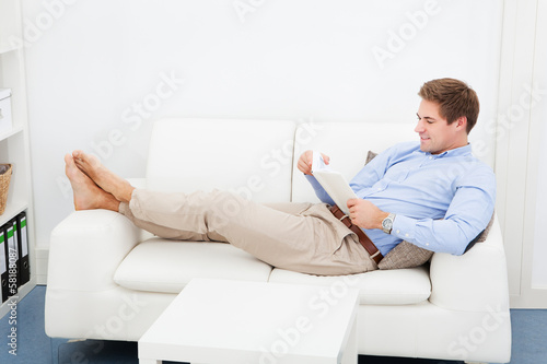 Young Man Reading Book