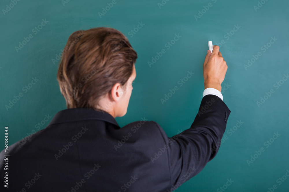 Professor Writing On Chalkboard Professor Writing On Chalkboard