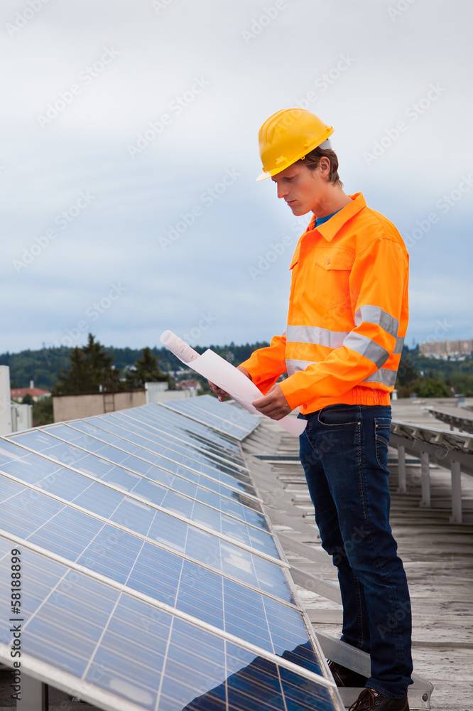 Obraz premium Engineer Holding Blueprint