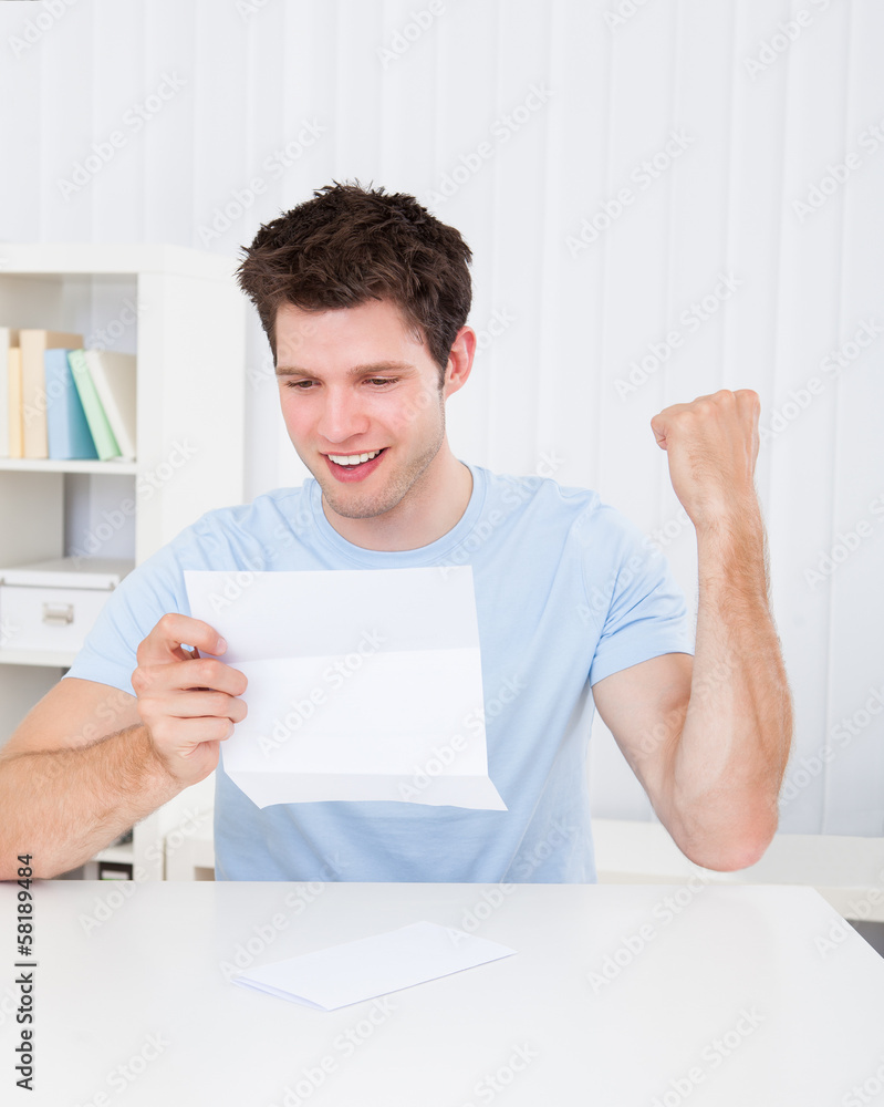 Happy Man Looking At Paper Happy Man Looking At Paper