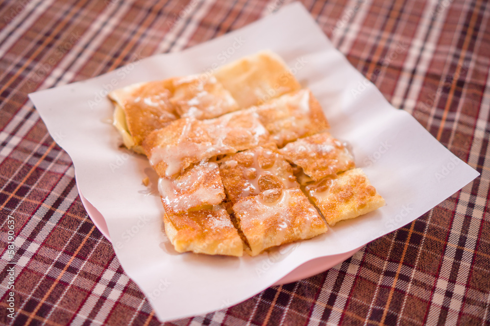 Pancakes with nuts and sugar caramel on top Pancakes with nuts and sugar caramel on top