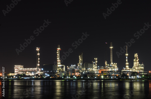 Petrochemical refinery plant illuminated at night
