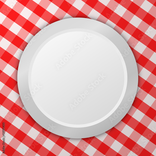 Empty plate on tablecloth