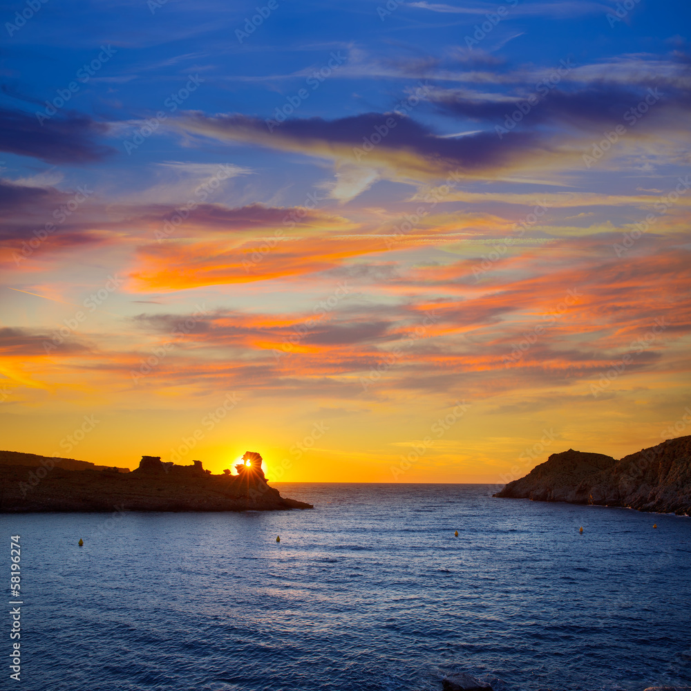 Menorca sunset in Cala Morell at Ses torretes beach