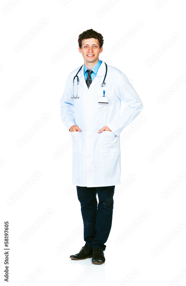 Full length portrait of the smiling doctor standing on a white