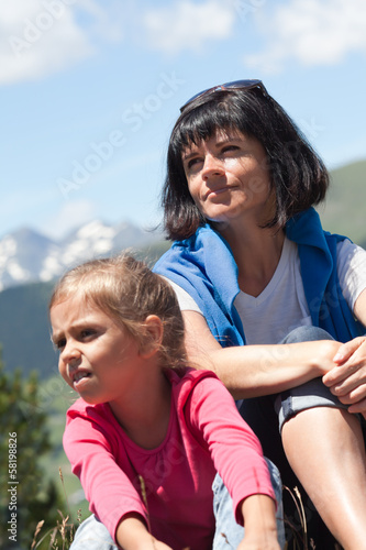 Mother with her daughter relaxing in the mountain