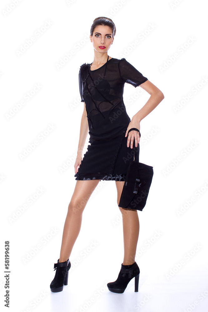 Portrait of a young brunette woman in designer clothes Portrait of a young brunette woman in designer clothes