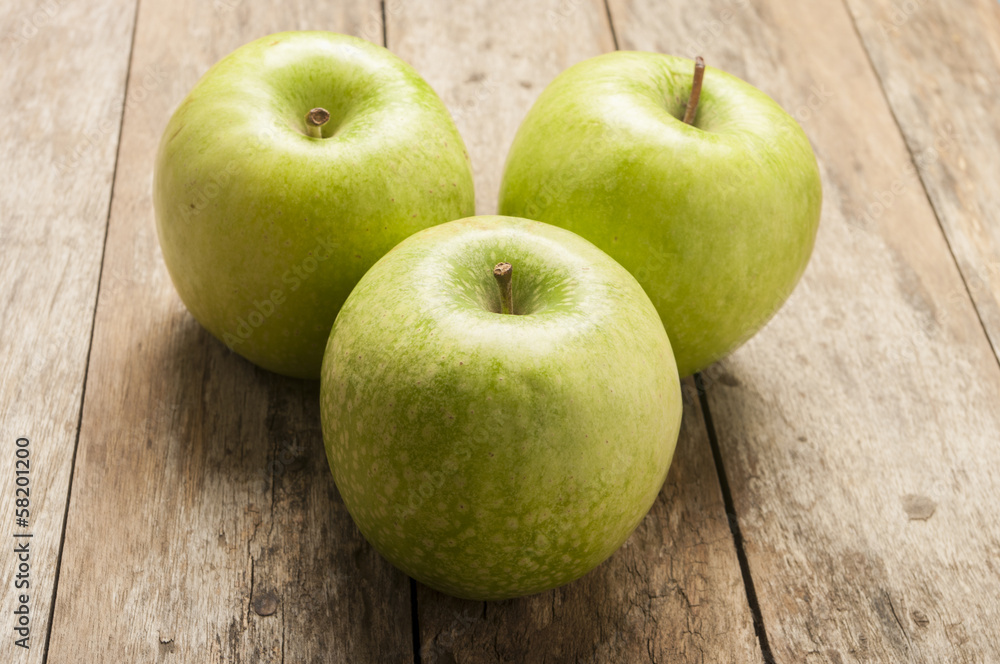 green apple on wooden background green apple on wooden background