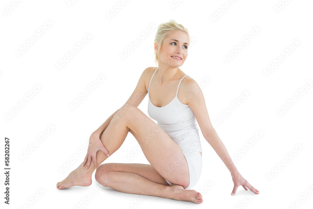 Full length of a smiling thoughtful toned woman Full length of a smiling thoughtful toned woman