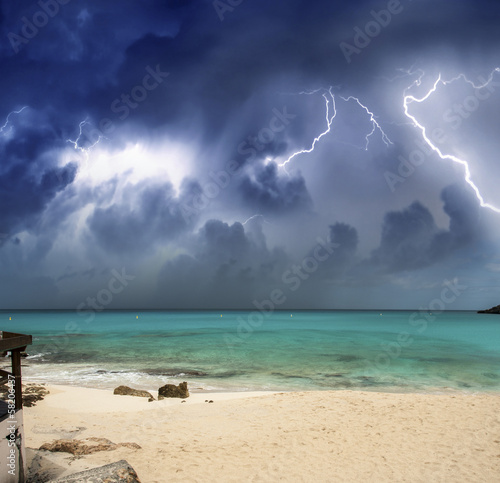 фотографія Beautiful beach at night with thunderstorm approaching