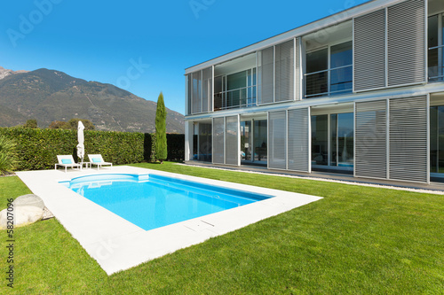 Modern house with pool, view from the garden © alexandre zveiger