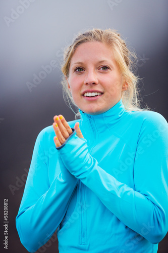 Young attractive athletic woman, wearing sporty cloths on trail