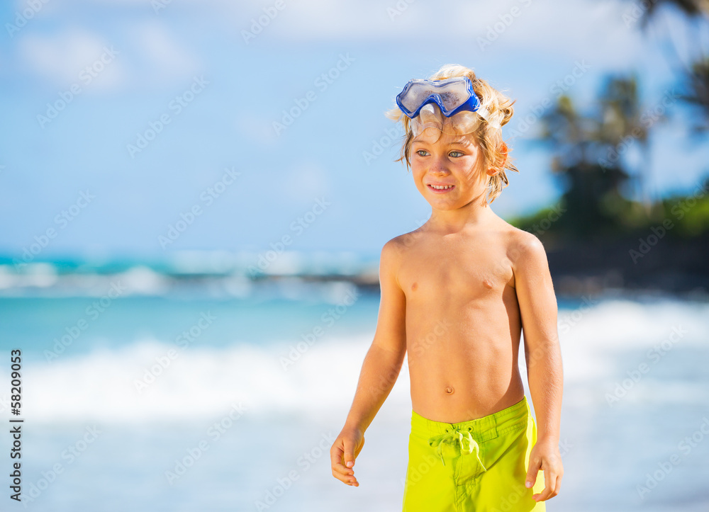 Happy Young boy having fun at the beach