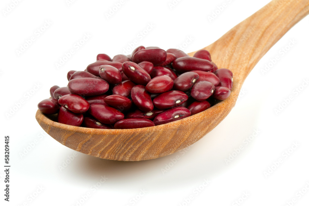 dried red beans in a spoon isolated on white background