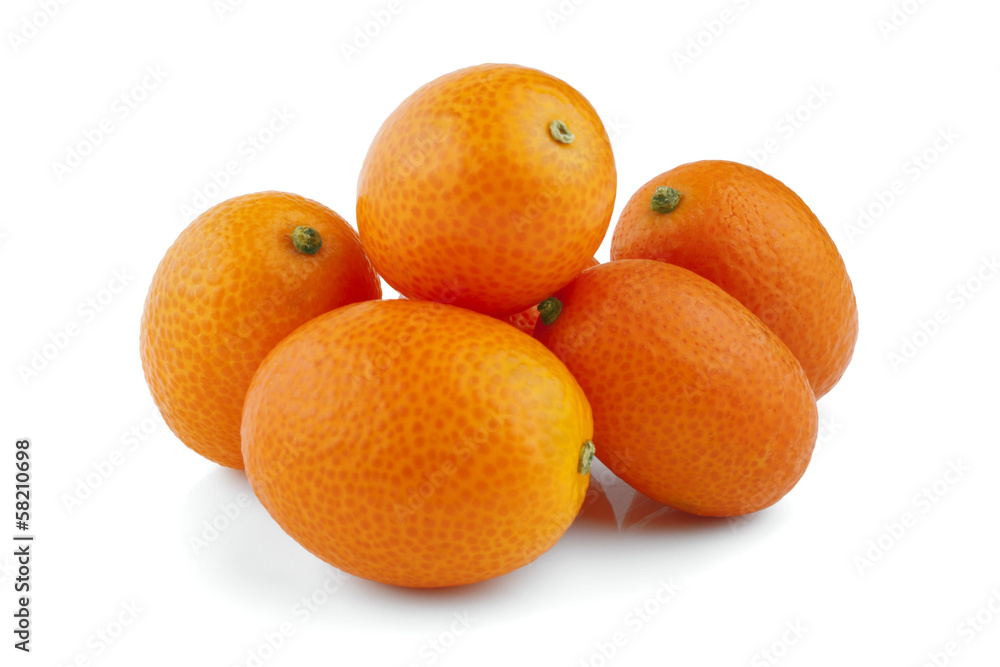 Sweet kumquat citrus fruits closeup on white Sweet kumquat citrus fruits closeup on white