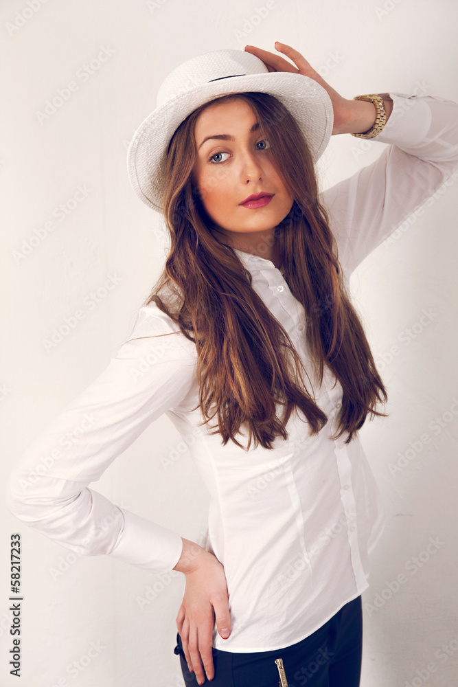 Fototapeta premium girl posing with a hat
