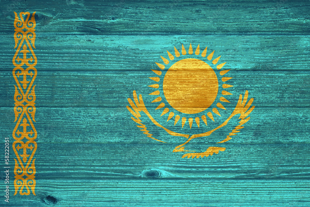 Kazakhstan Flag painted on old wood plank background.