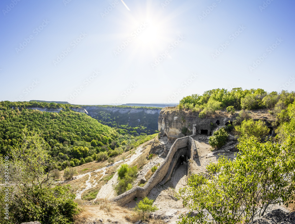 The sun shines over the ancient cave city chufut-Kale, Crimea, U