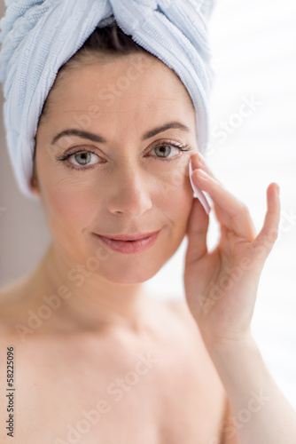 Woman in her forties removing make up