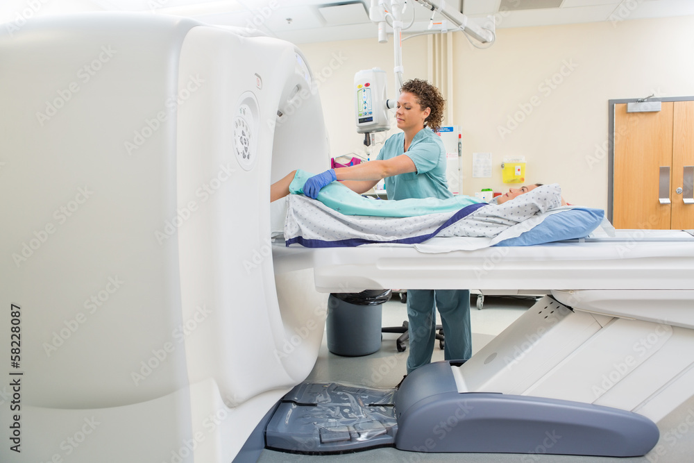 Nurse Preparing Patient For CT Scan Test Nurse Preparing Patient For CT Scan Test