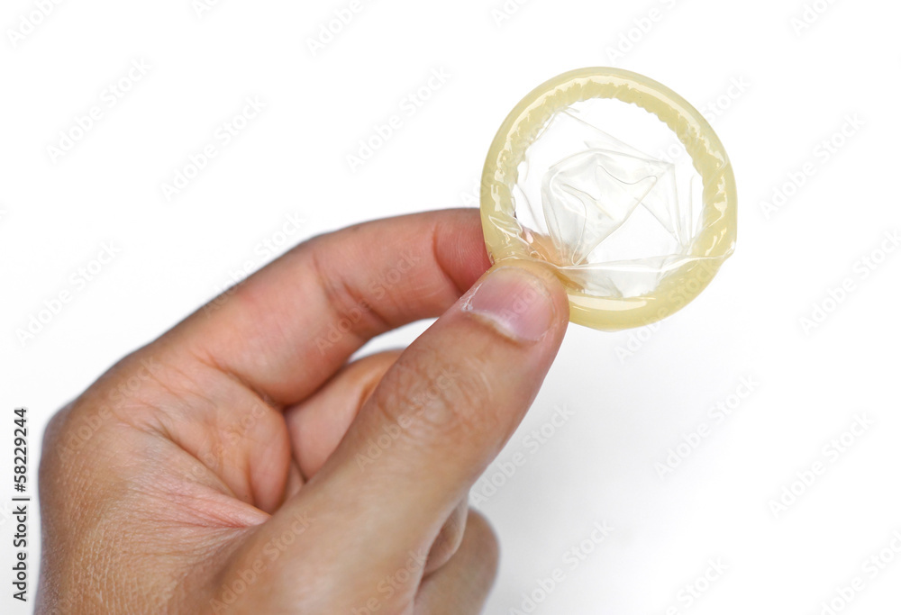 hand holding a condom hand holding a condom