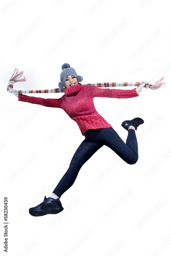 Winter woman jumping full of joy