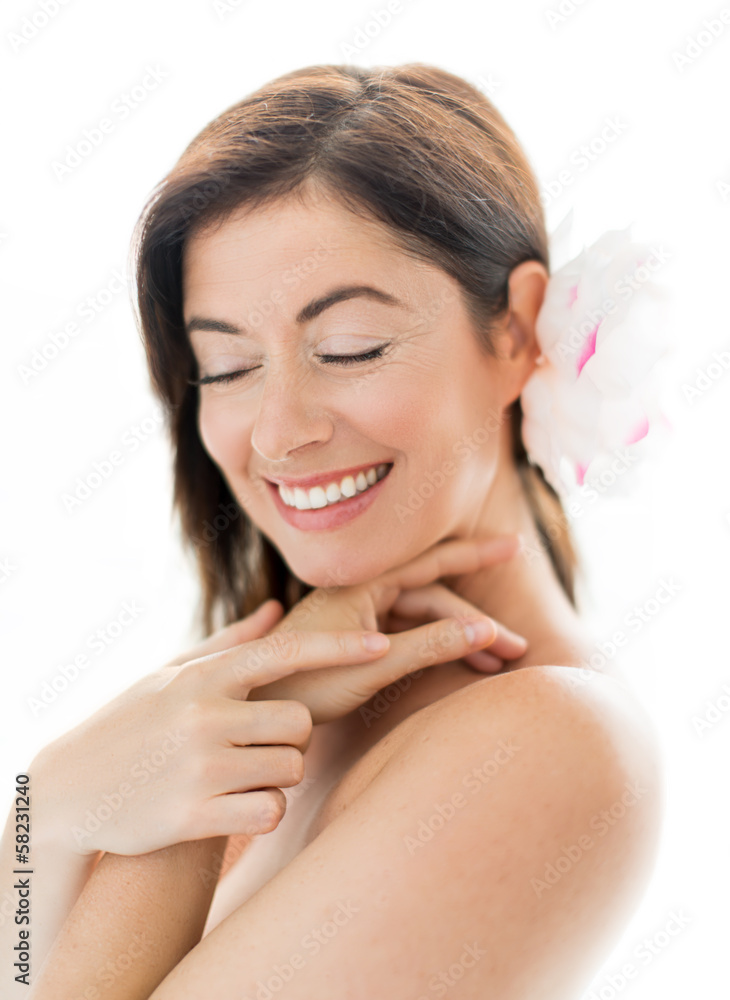 Woman in her forties with a flower Woman in her forties with a flower