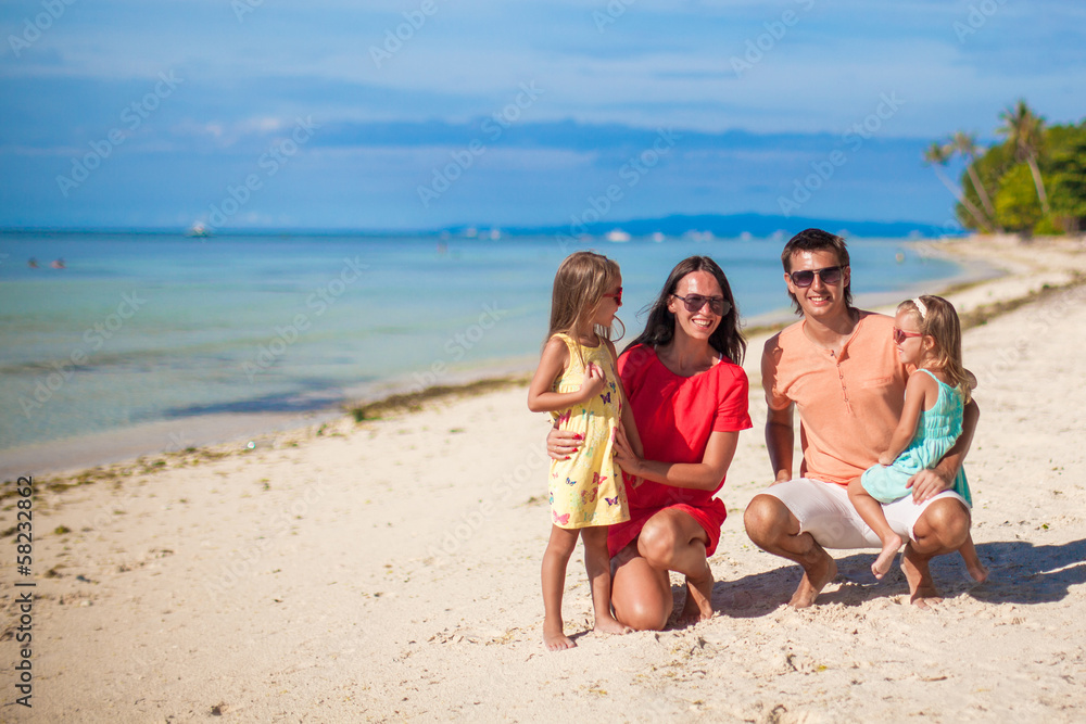 Portrait of a beautiful Caucasian family on tropical vacation Portrait of a beautiful Caucasian family on tropical vacation