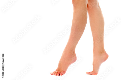 Woman walking on toes, closeup shot. © stockyimages