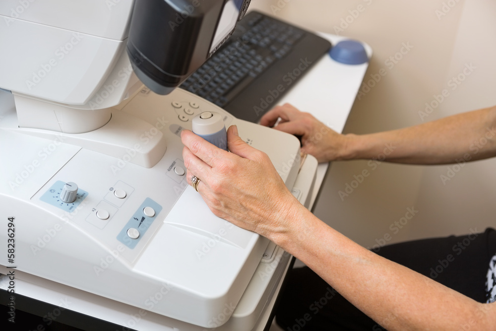 Optometrist Using Digital Retina Camera Optometrist Using Digital Retina Camera