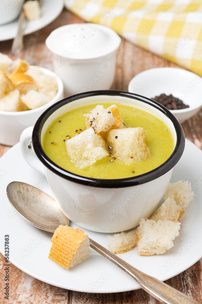 zucchini soup with croutons in a cup, close-up zucchini soup with croutons in a cup, close-up