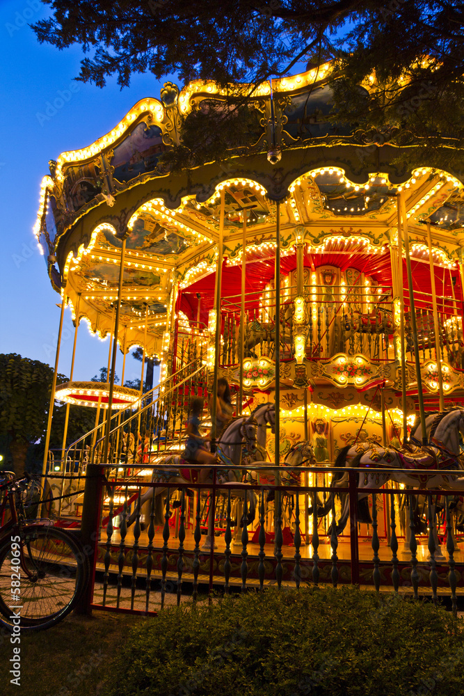 Merry-go-round carousel at night, Lignano Sabbiadoro, Italy Merry-go-round carousel at night, Lignano Sabbiadoro, Italy