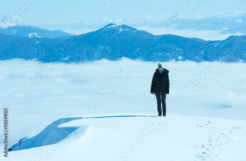 Woman on winter mountain top © wildman