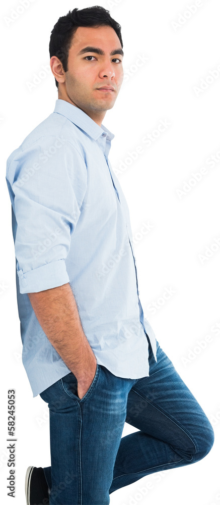 Unsmiling casual man standing Unsmiling casual man standing