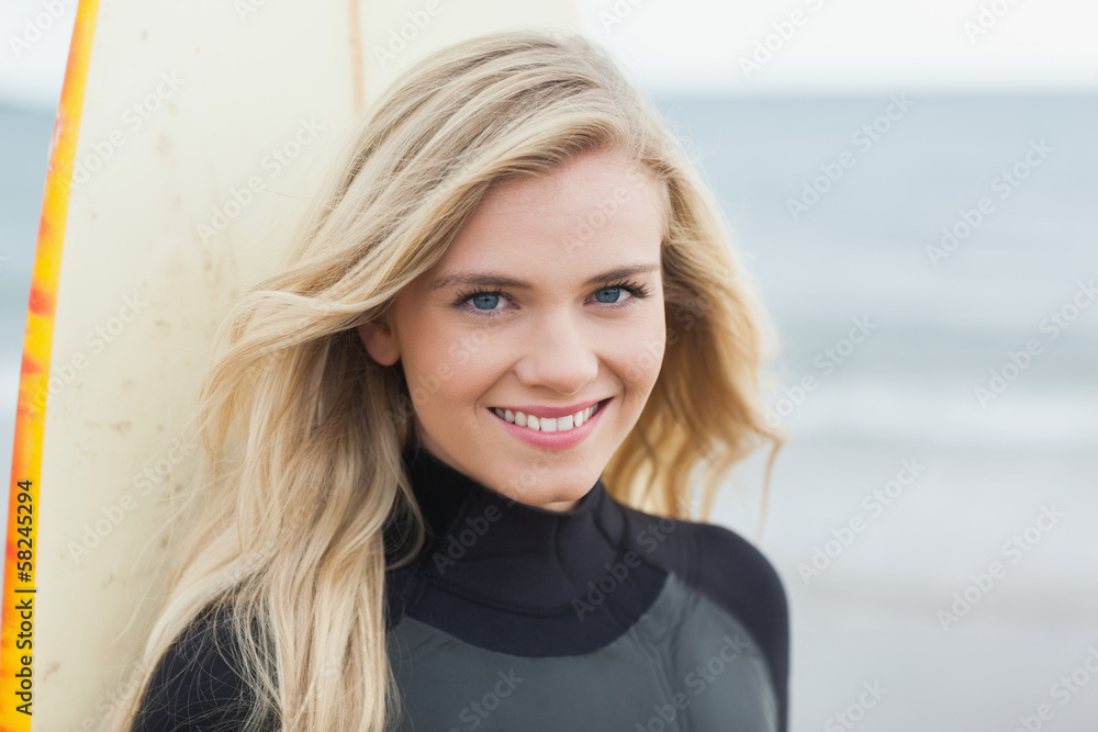 Portrait of a smiling beautiful woman with surfboard Portrait of a smiling beautiful woman with surfboard