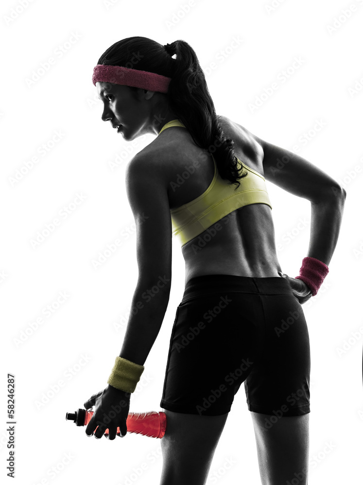 woman exercising fitness holding energy drink silhouette woman exercising fitness holding energy drink silhouette