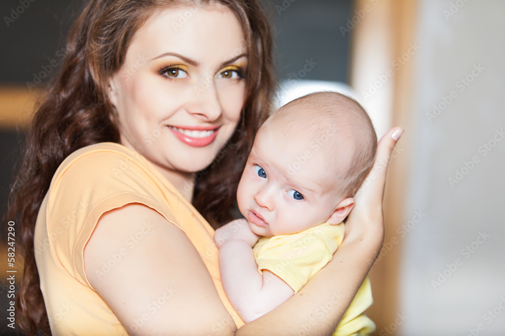 mother with her cute baby on the couch at home mother with her cute baby on the couch at home