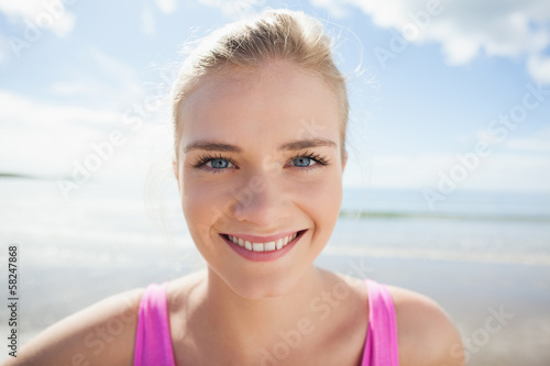 Close up of a smiling woman on beach