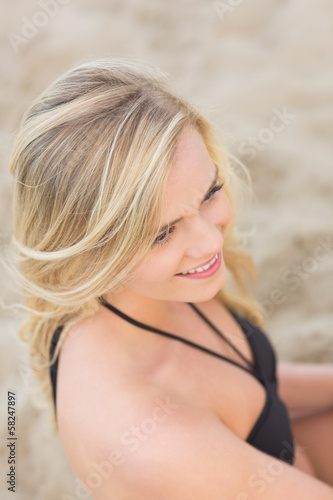 Overhead Close up of a smiling relaxed blond at beach