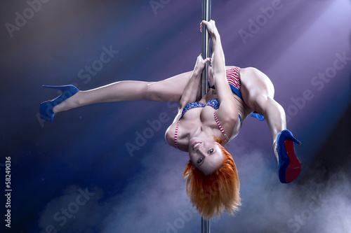 Young sexy pole dance woman.