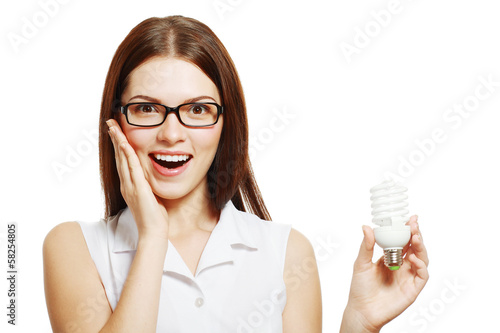 woman in glasses holding lamp