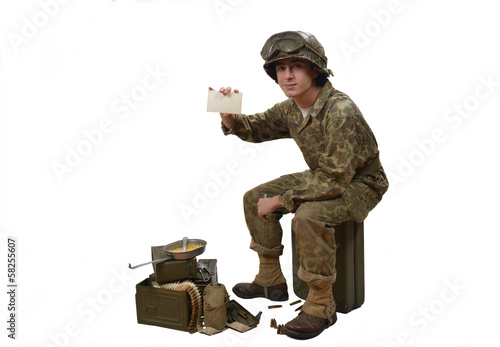 young American soldier shows a photograph