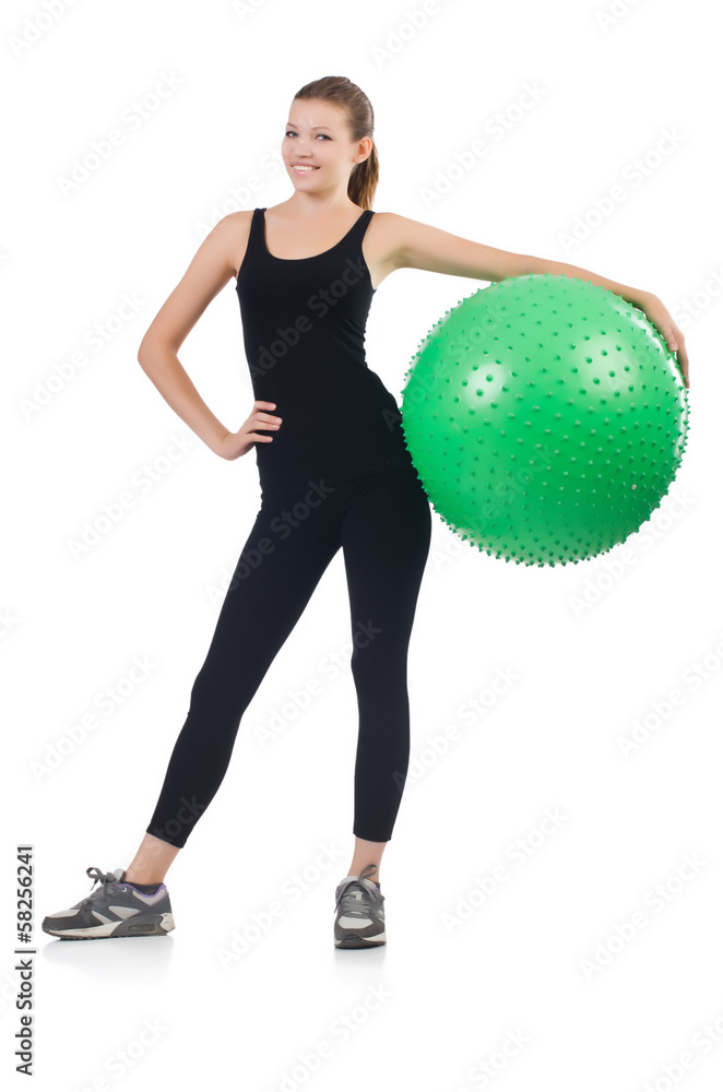 Young woman with ball exercising on whitee