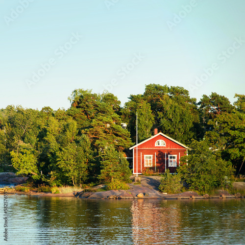 Scandinavian fisherman Red House on sea