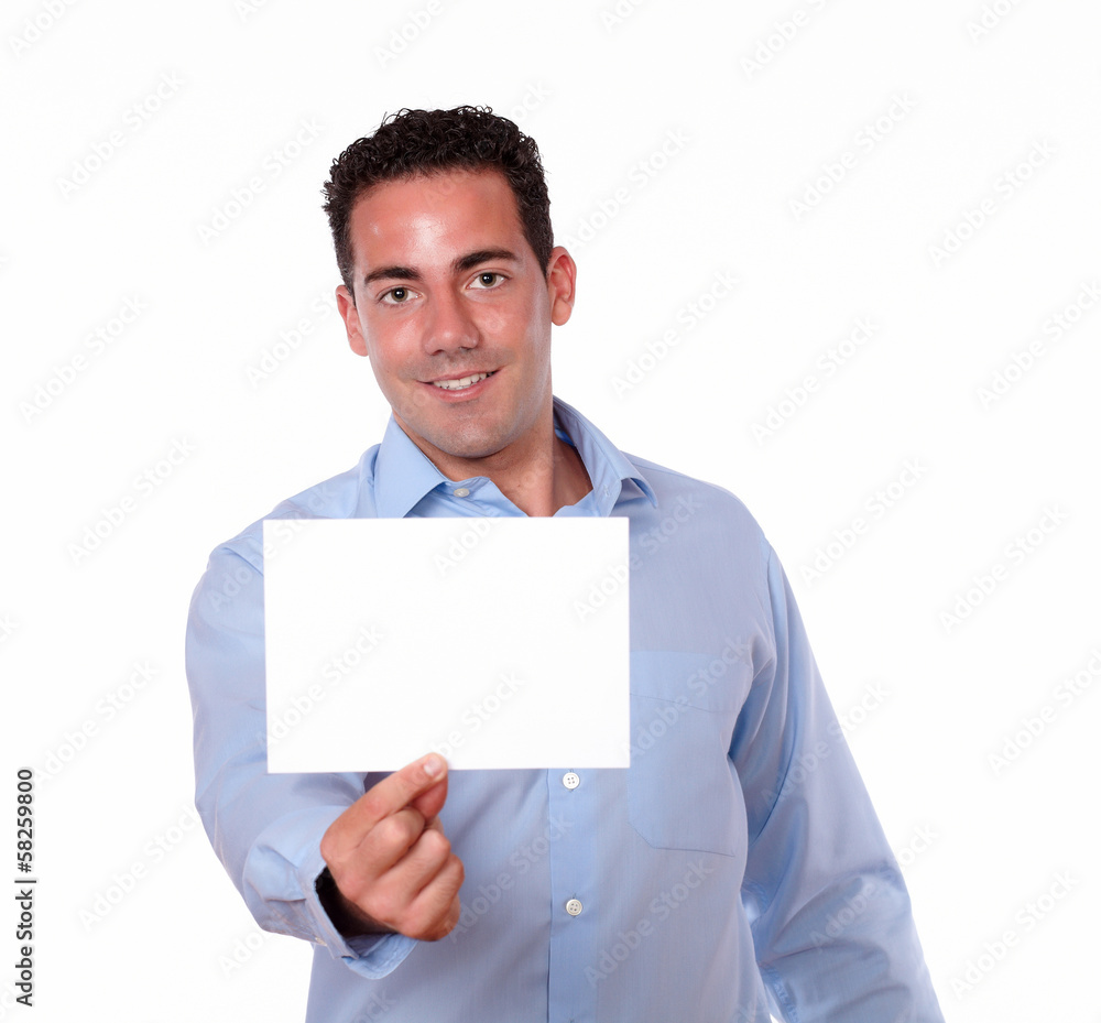 Attractive hispanic guy holding a white card Attractive hispanic guy holding a white card