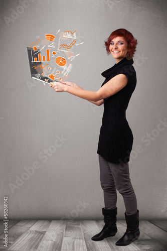 Beautiful lady holding notebook with graphs and statistics photo