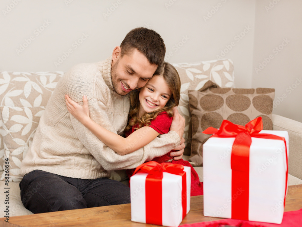 smiling father and daughter hugging smiling father and daughter hugging
